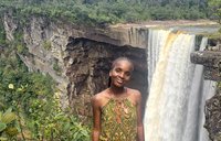 PCV Emalee Finn stands in front of a waterfall