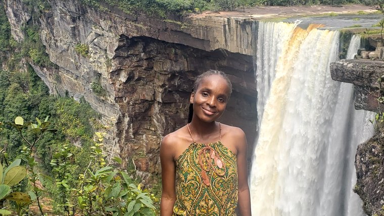 PCV Emalee Finn stands in front of a waterfall