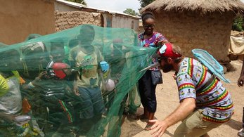 Malawi PCV Teaching Students About Malaria Dressed Up As a Mosquito