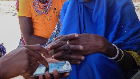 Woman holds cell phone in her hands