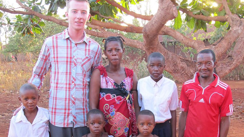 Robbie Lehman with a family in Tanzania