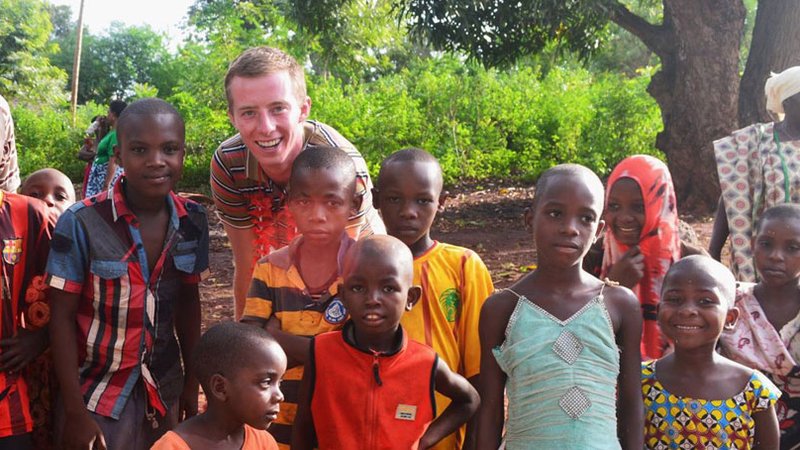 Robbie Lehman with a group of children in Tanzania