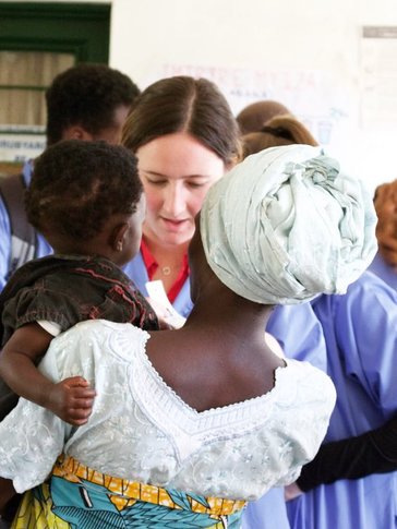 Health Volunteer with woman and child