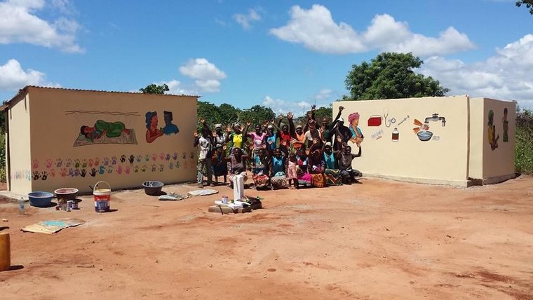 Women helped construct sanitation facilities at a clinic in Mozambique.