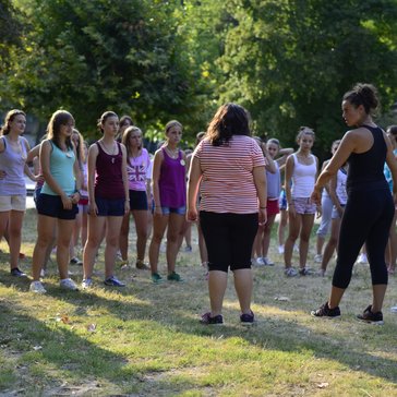 Young women take self-defense instruction at a GLOW Camp session.