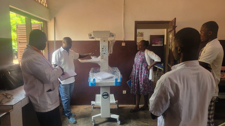 Health center staff with new equipment for the maternity clinic in Togo.