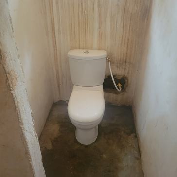 A toilet was installed as an upgrade to a maternity clinic in Togo.