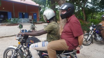 Two persons on a motorcycle