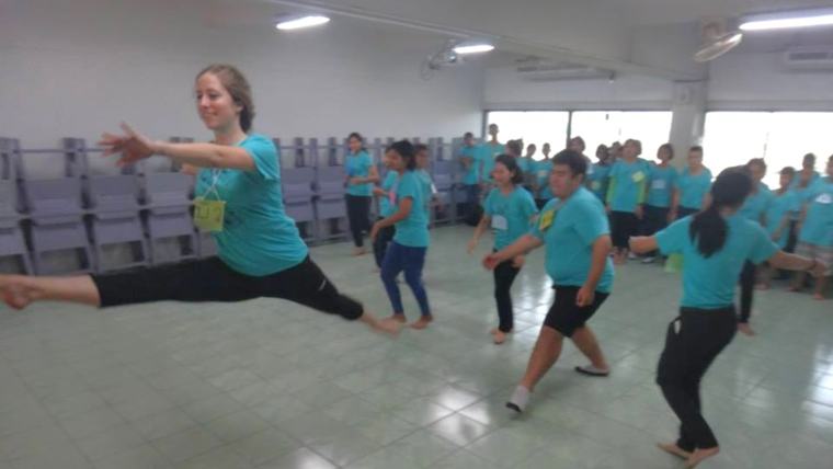 Rebecca leads youth in a dance class in Dominica.