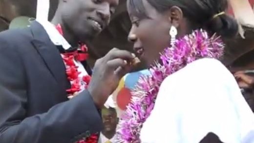 A Malawian couple celebrate their marriage with their community.