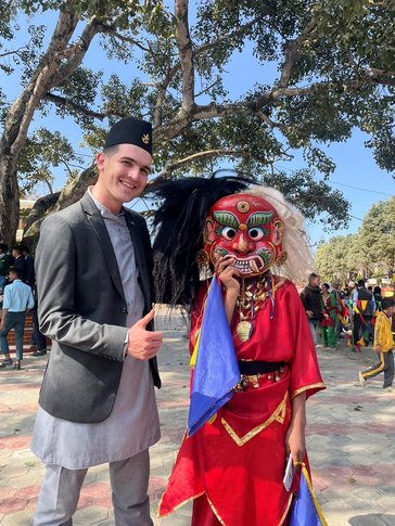 Steven with a student at a school celebration in Nepal.