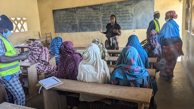 trek to fight malaria - women in classroom