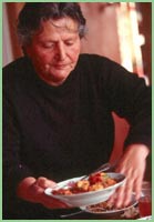 Photo of woman serving food in Armenia.