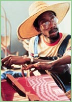 Photo of man weaving in Ghana.