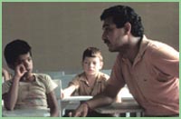 Photo of man teaching children in Honduras.