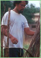 Photo of man fixing fence in Ghana.