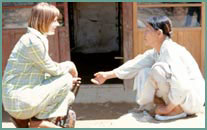 Photo of Volunteer and Host Country National.