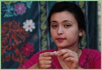 Photo of young woman in a market in Uzbekestan.